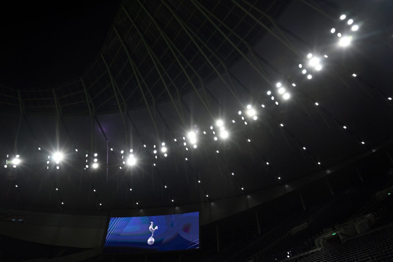 The floodlights shine above the scoreboard ahead of the second leg of the English League Cup semi final football match between Tottenham Hotspur an...
