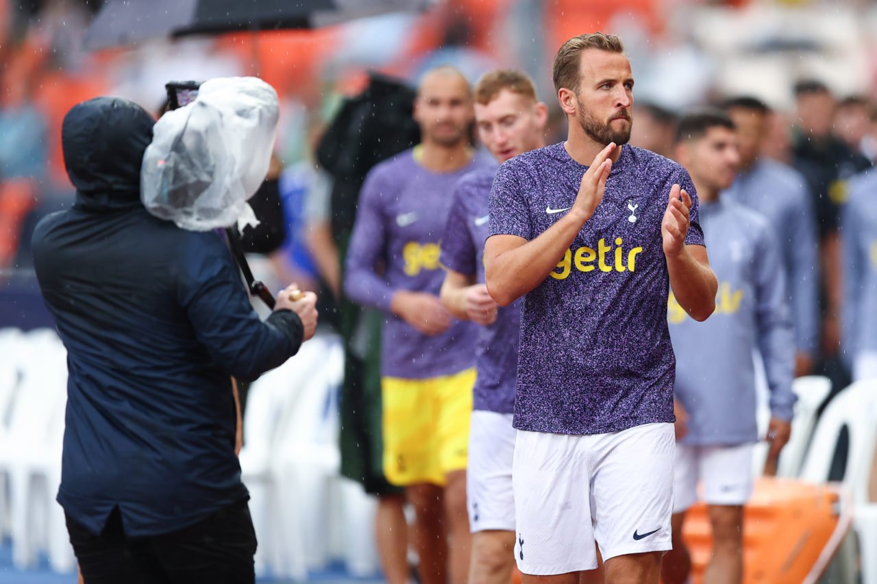Harry Kane of Tottenham Hotspur (R) leads his teammate to applaud supporters after the cancelled preseason friendly match between Tottenham Hotspur...