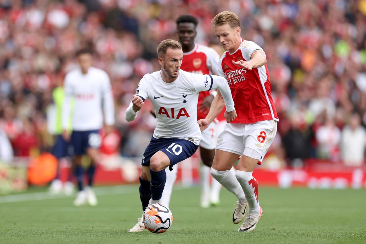 James Maddison of Tottenham Hotspur is challenged by Martin Oedegaard of Arsenal during the Premier League match between Arsenal FC and Tottenham H...
