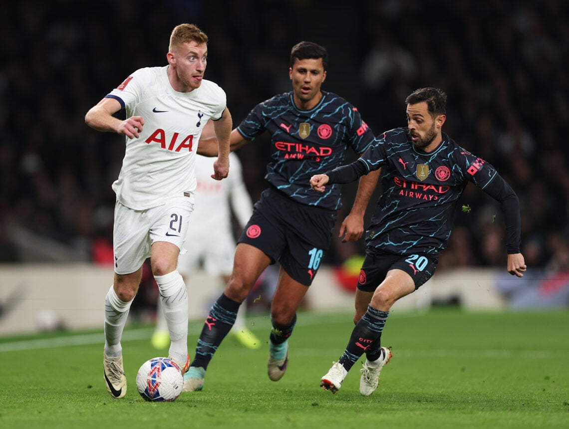 Dejan Kulusevski of Tottenham Hotspur runs ahead of Rodri and Bernardo Silva of Manchester City during the Emirates FA Cup Fourth Round match betwe...
