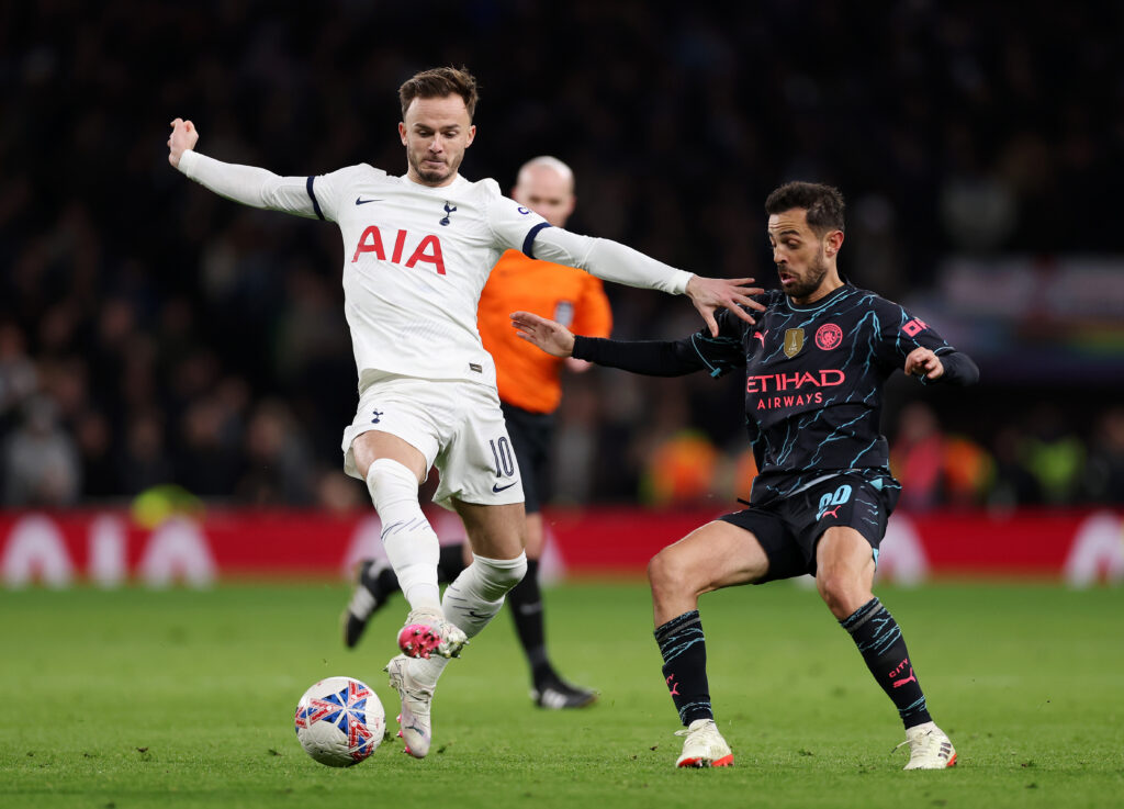 James Maddison of Tottenham Hotspur is challenged by Bernardo Silva of Manchester City during the Emirates FA Cup Fourth Round match between Totten...