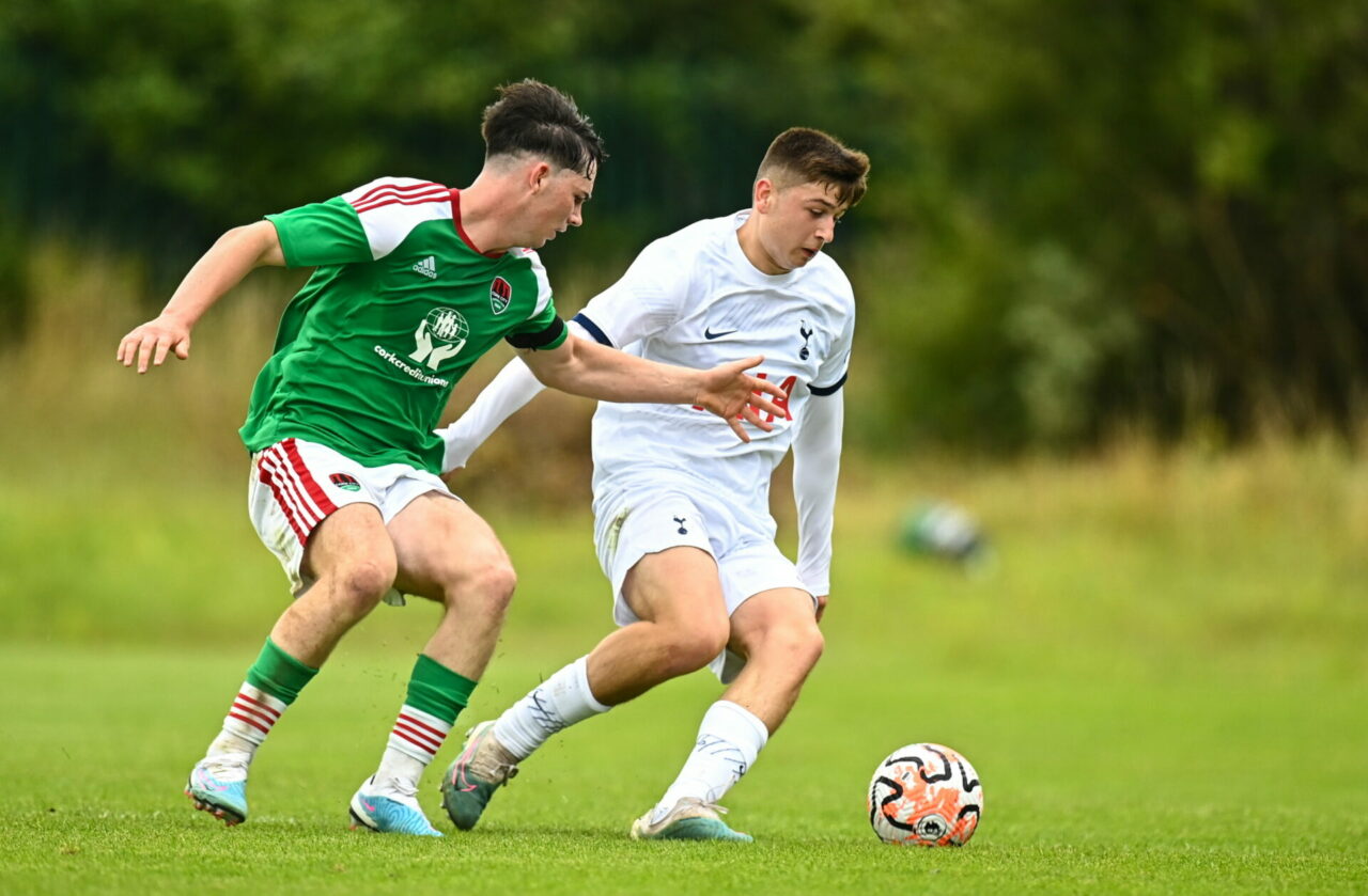 Cork , Ireland - 21 July 2023; Mikey Moore of Tottenham Hotspur in action against Sam Bailey of Cork City during the friendly match between Cork Ci...