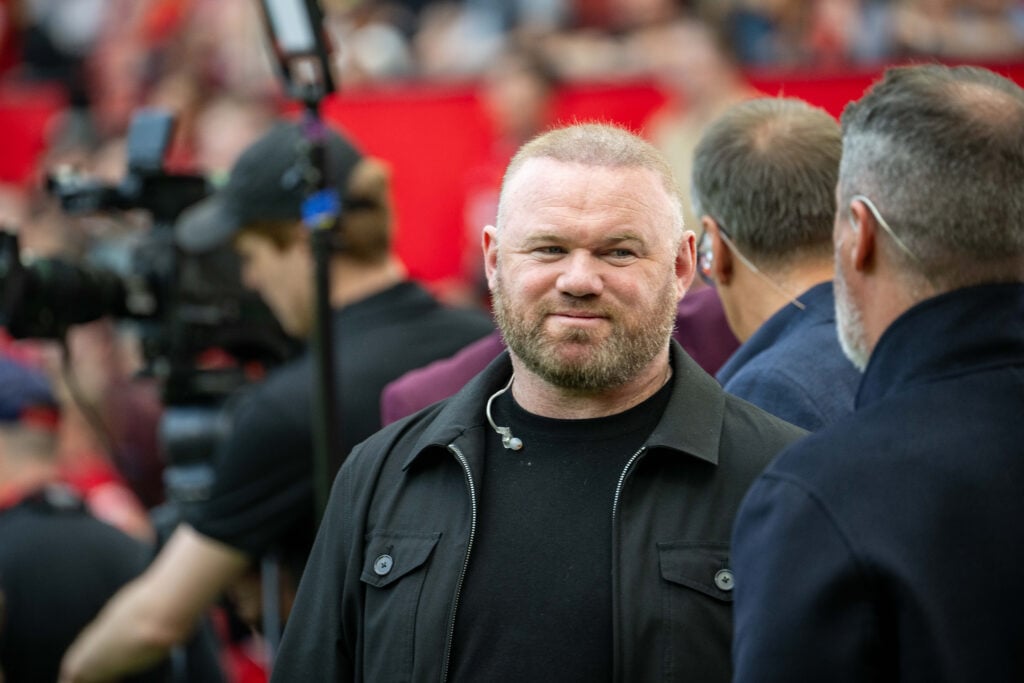 Former Manchester United player and Sky Sports pundit Wayne Rooney stands pitchside ahead of the Premier League match between Manchester United and...