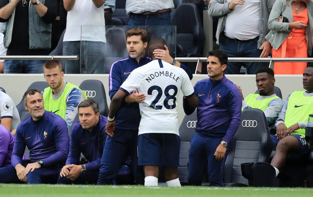 Tanguy Ndombele of Tottenham Hotspur is greeted by Mauricio Pochettino, Manager of Tottenham Hotspur after Tanguy Ndombele is substituted off durin...