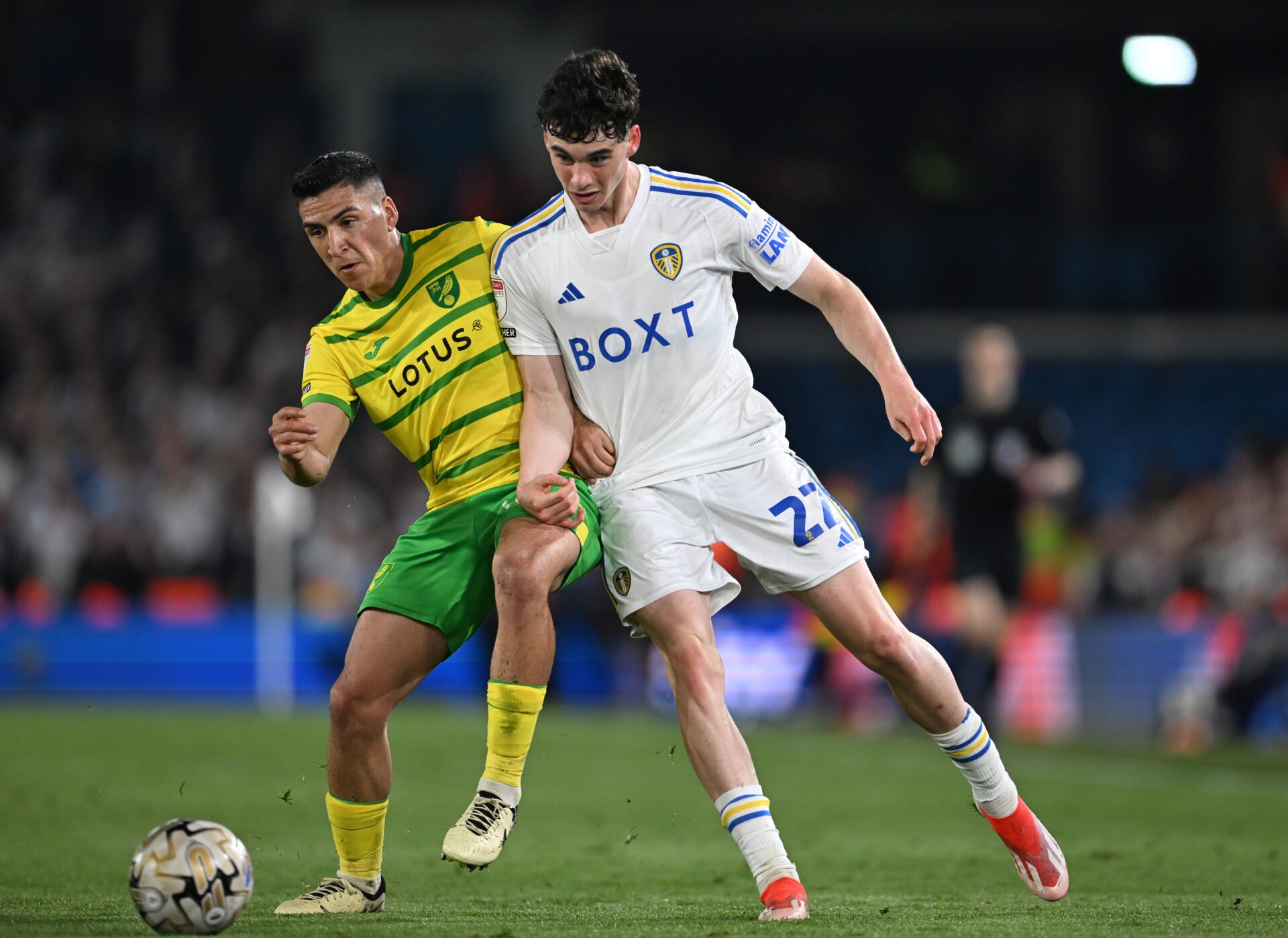 Archie Gray of Leeds United is challenged by Marcelino Nunez of Norwich City during the Sky Bet Championship Play-Off Semi-Final 2nd Leg match betw...
