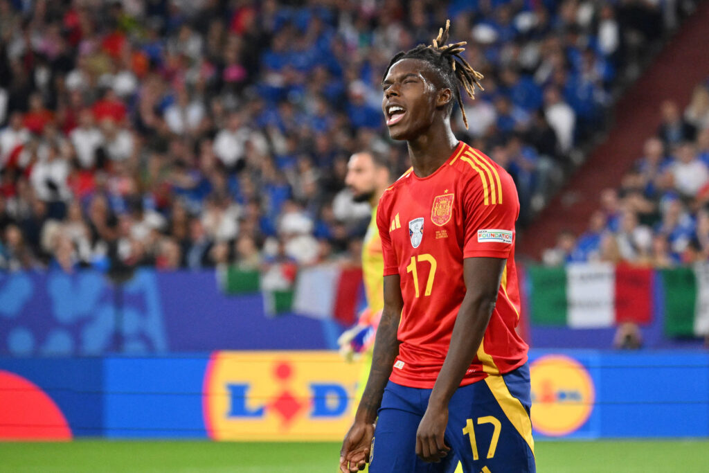 Spain's midfielder #17 Nico Williams reacts to a missed chance during the UEFA Euro 2024 Group B football match between Spain and Italy at the Aren...