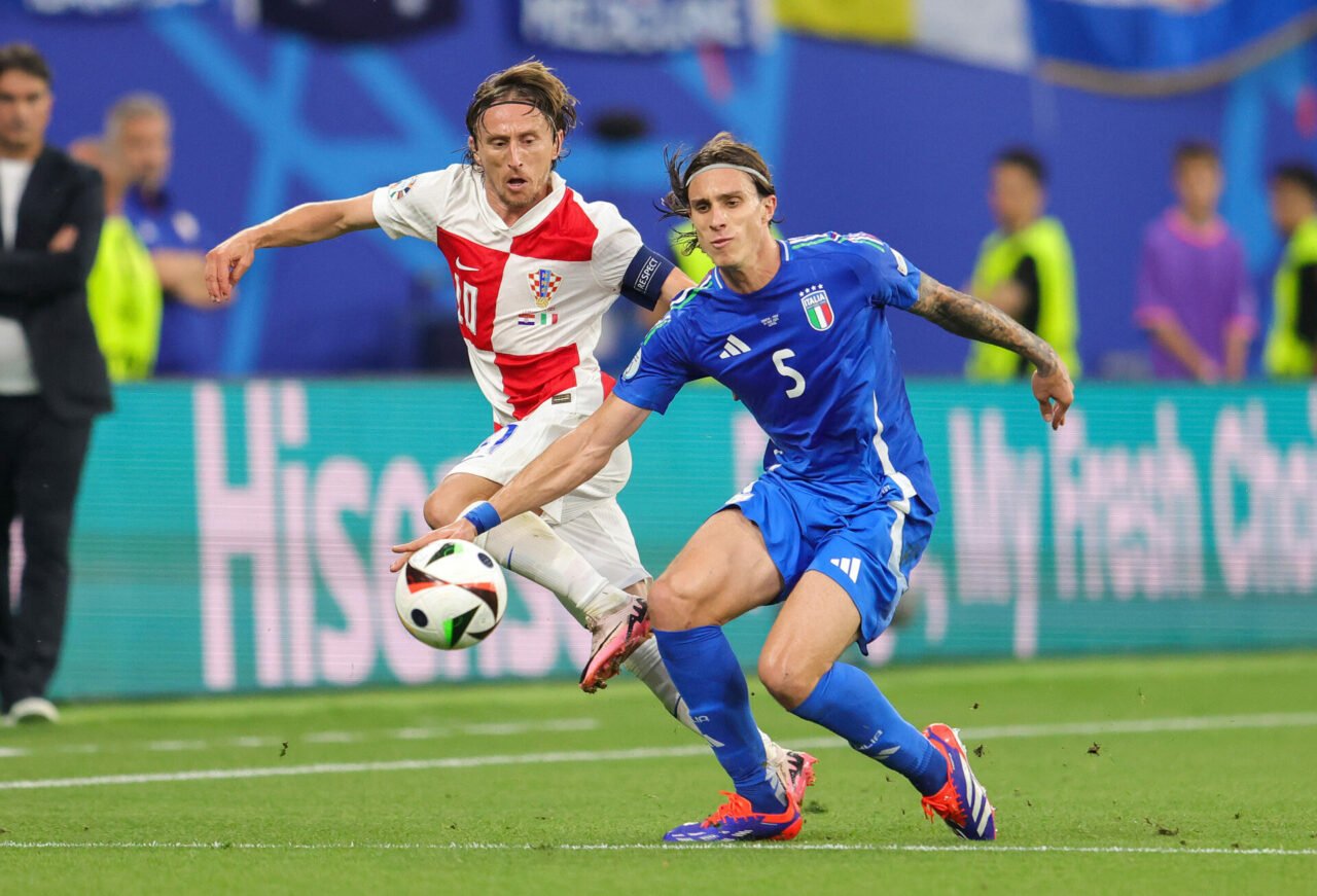 (LR) Luka Modric of Croatia and Riccardo Calafiori of Italy compete for the ball during the UEFA EURO 2024 group stage match between Croatia and It...