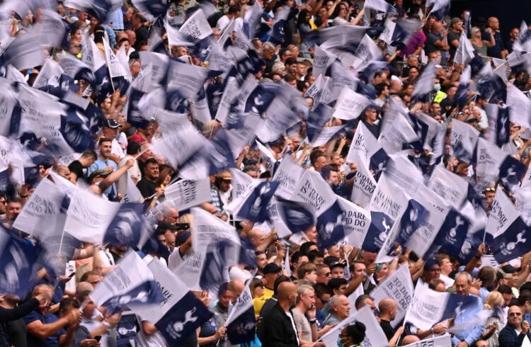Tottenham Hotspur fans wave flags prior to the Premier League match between Tottenham Hotspur and Manchester City at Tottenham Hotspur Stadium on A...