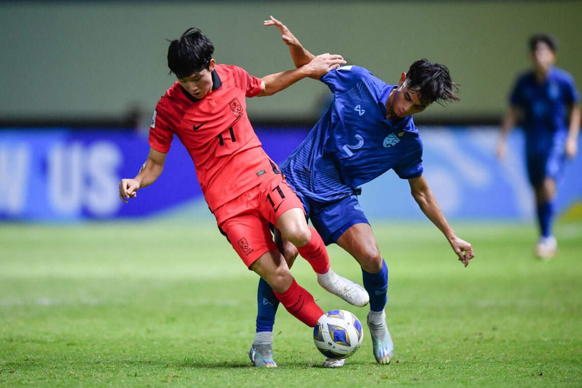 Yang Min-Hyuk (No.11) of the Korea Republic and Chanasorn Choklap (No. 2) of Thailand seen during the AFC U17 ASIAN CUP THAILAND 2023 match between...