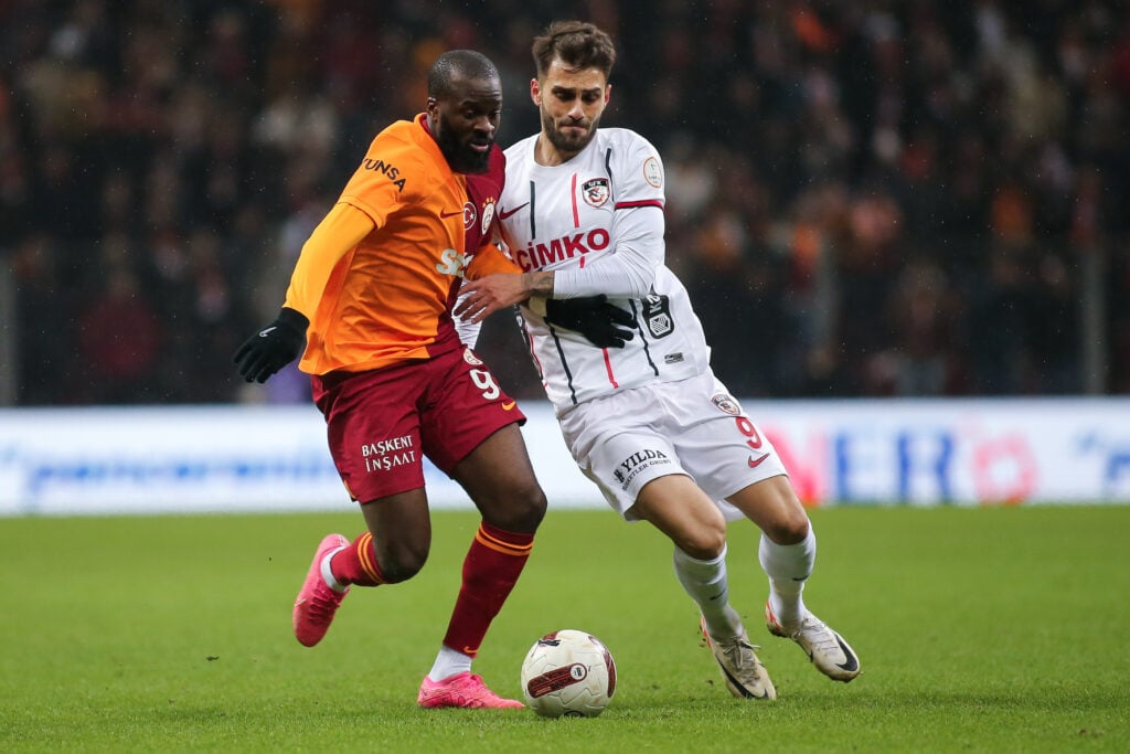 Tanguy Ndombele of Galatasaray is challenged by lker Karakas during the Turkish Super League match between Galatasaray and Gaziantep at Rams Park o...