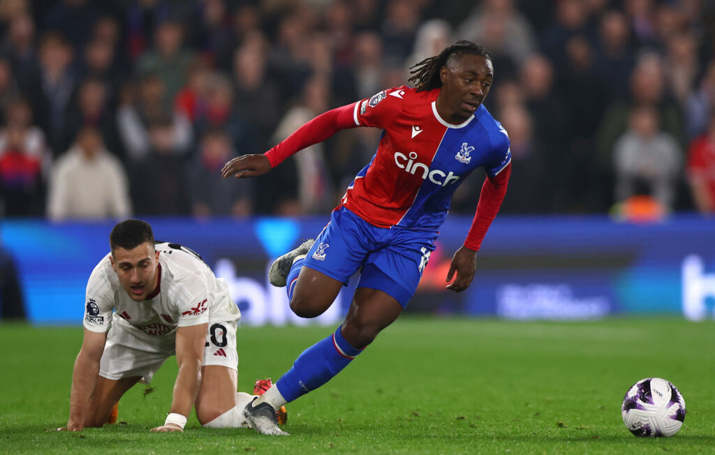 Diogo Dalot of Manchester United and Eberchi Eze of Crystal Palace in action  during the Premier League match between Crystal Palace and Manchester...