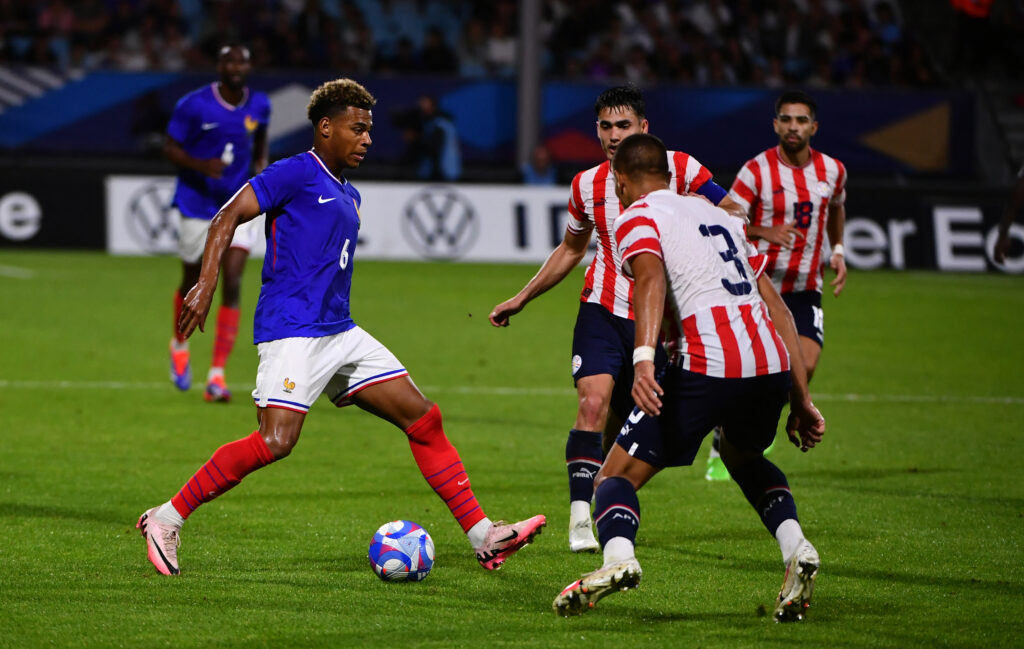 France's midfielder #06 Desire Doue (L) controls the ball during the U23 friendly football match between France and Paraguay at Jean Dauger stadium...