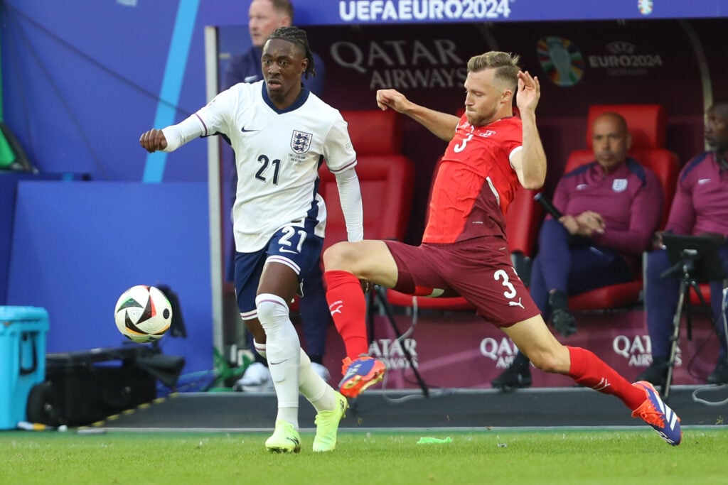 Eberechi Eze of England and Silvan Widmer of Switzerland battle for the ball during the UEFA EURO 2024 - Quarter-final match between England and Sw...