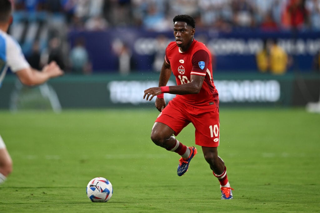 Jonathan David #10 of Canada dribbles the ball during the Copa America 2024 semifinal match between Argentina and Canada at MetLife Stadium on July...
