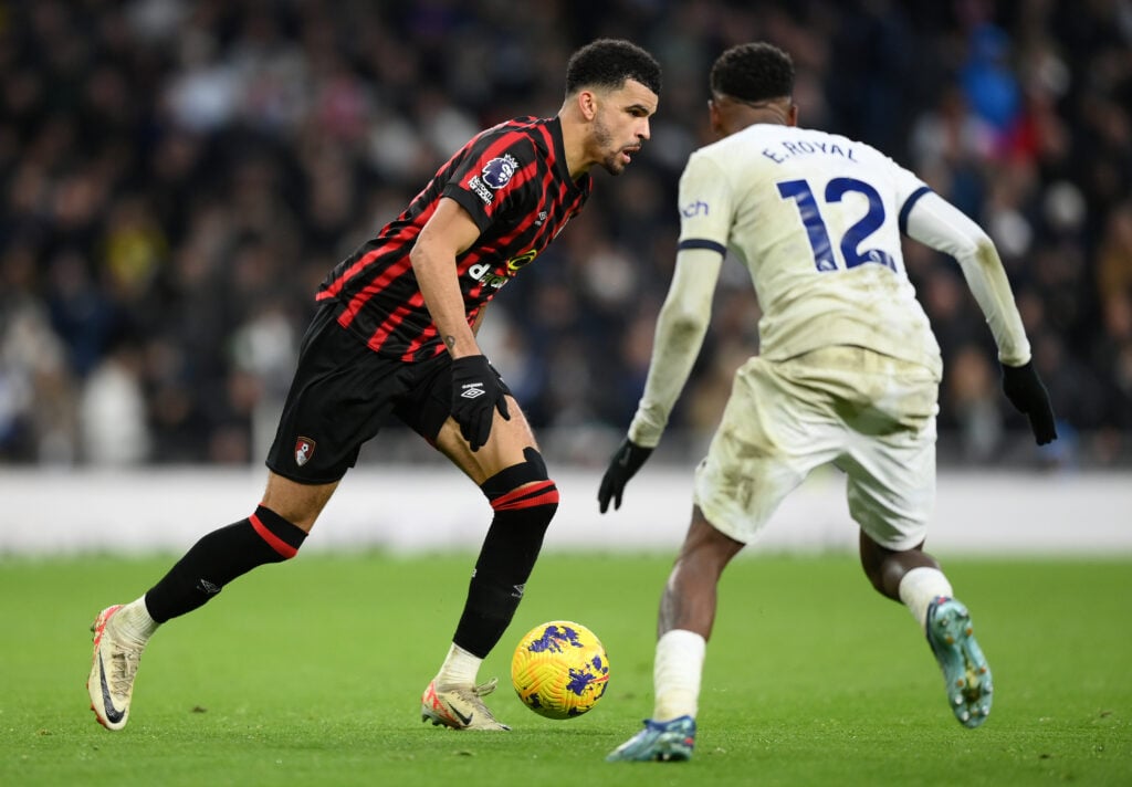 Dominic Solanke of AFC Bournemouth runs with the ball whilst under pressure from Emerson of Tottenham Hotspur during the Premier League match betwe...