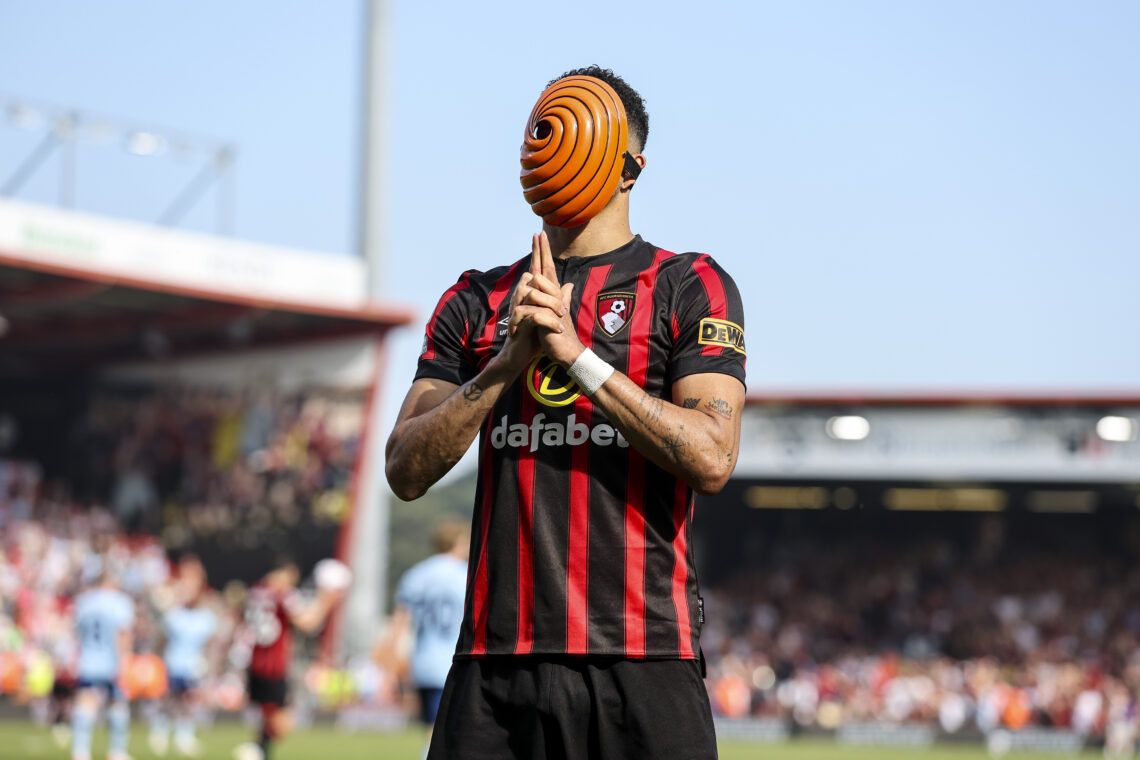 Dominic Solanke of Bournemouth wears a Japanese Anime mask in celebration after he scores a goal to make it 1-1 during the Premier League match bet...